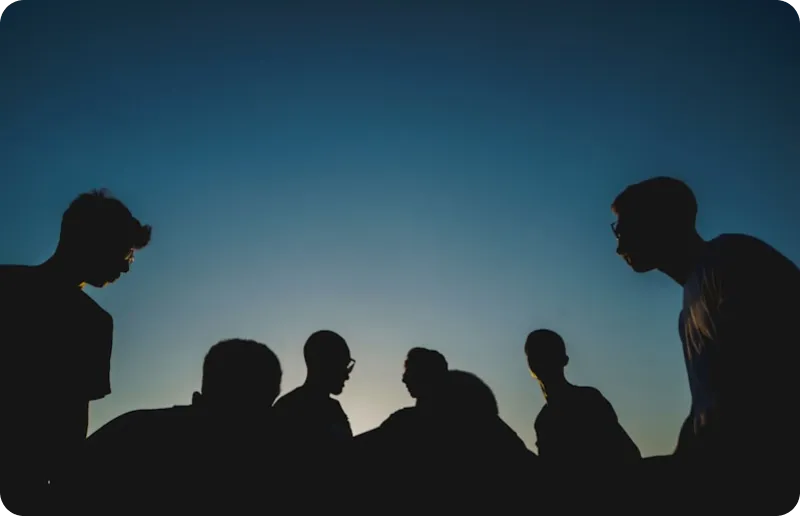 Team silhouettes at sunset