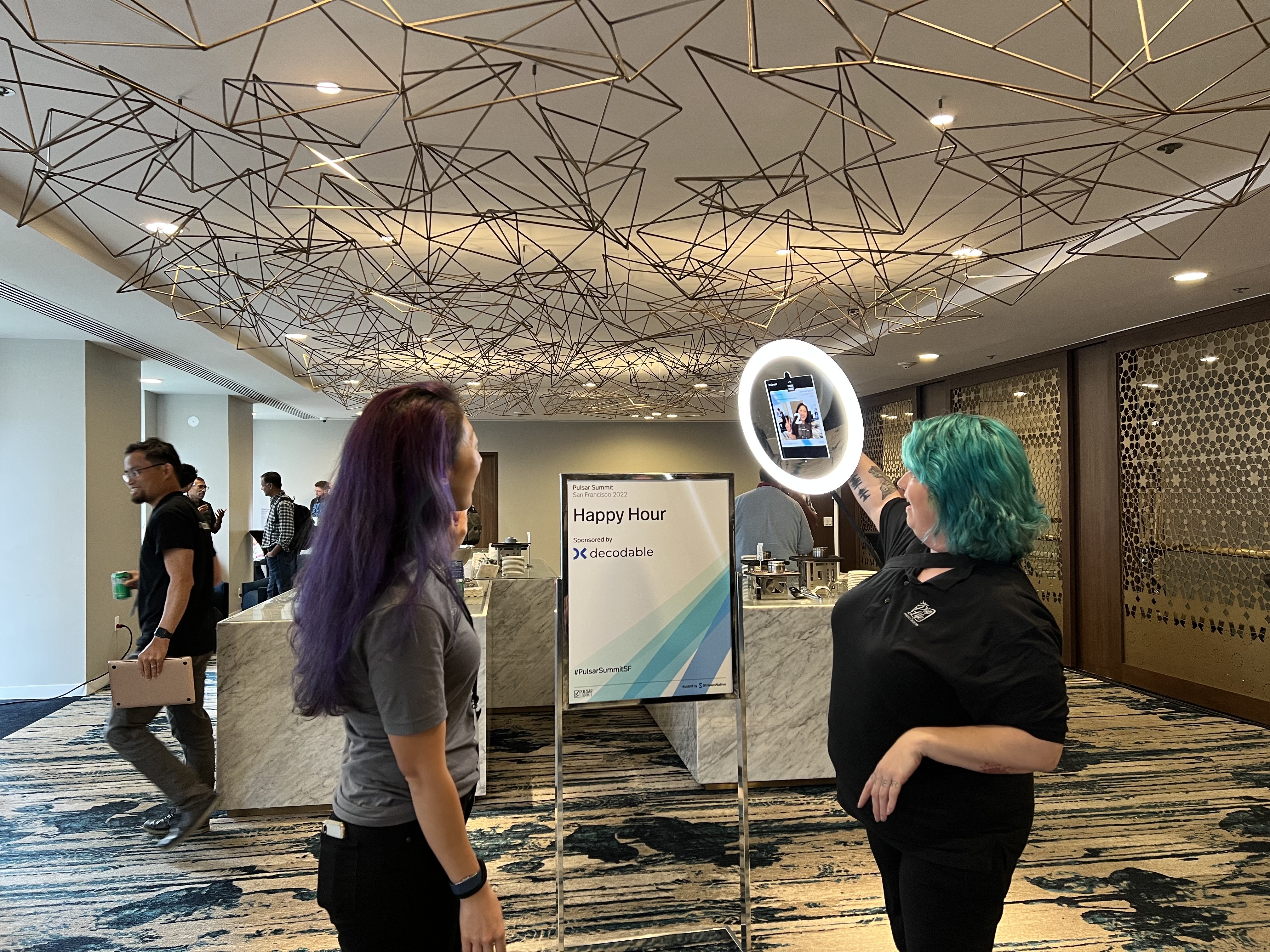 people taking a picture at the pulsar summit 2022